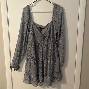 Grayish blue dress with flower patterns. Zipper on the side and tie in front.